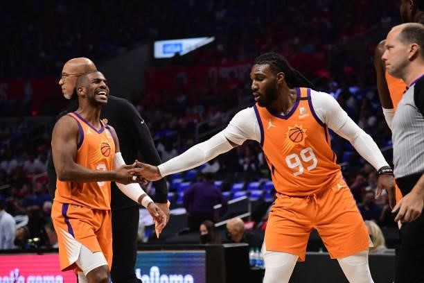 Chris Paul hi-five Jae Crowder of the Phoenix Suns during Game 6 of the Western Conference Finals of the 2021 NBA Playoffs on June 30, 2021 at...