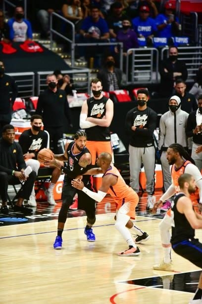 Paul George of the LA Clippers handles the ball as Chris Paul of the Phoenix Suns plays defense during the game during Game 6 of the Western...