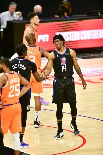 Reggie Jackson of the LA Clippers high fives Terance Mann of the LA Clippers during the game against the Phoenix Suns during Game 6 of the Western...