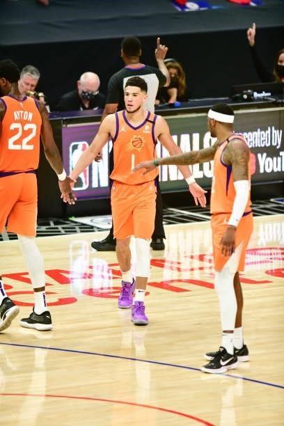 Devin Booker of the Phoenix Suns high fives Torrey Craig of the Phoenix Suns during the game against the LA Clippers during Game 6 of the Western...
