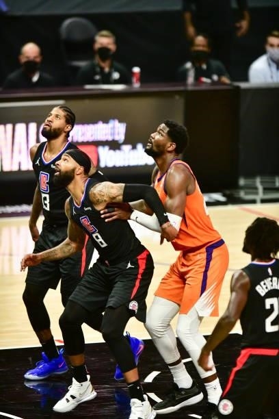 Marcus Morris Sr. #8 of the LA Clippers and Deandre Ayton of the Phoenix Suns fight for position during Game 6 of the Western Conference Finals of...