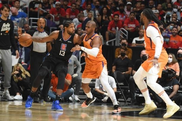 Chris Paul of the Phoenix Suns plays defense on Paul George of the LA Clippers during Game 6 of the Western Conference Finals of the 2021 NBA...