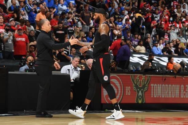 Marcus Morris Sr. #8 of the LA Clippers high fives Head Coach Tyronn Lue of the Los Angeles Clippers during Game 6 of the Western Conference Finals...