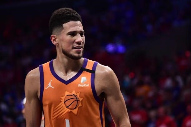 Devin Booker of the Phoenix Suns smiles during Game 6 of the Western Conference Finals of the 2021 NBA Playoffs on June 30, 2021 at STAPLES Center in...