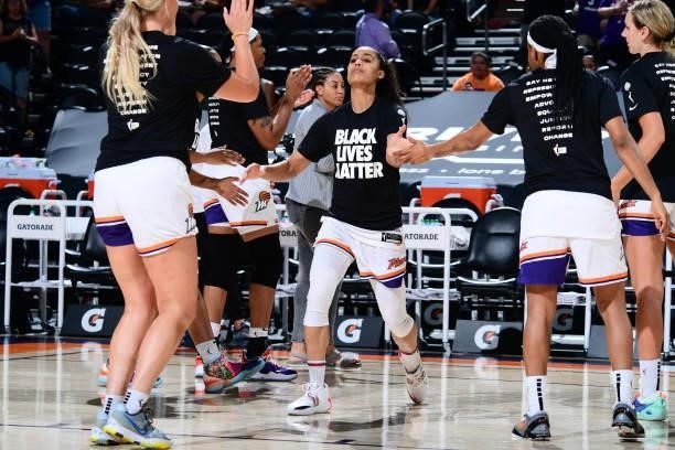 Skylar Diggins-Smith of the Phoenix Mercury high fives her teammates before the game against the Minnesota Lynx on June 30, 2021 at Phoenix Suns...