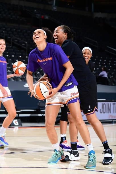 Brianna Turner of the Phoenix Mercury smiles alongside Assistant Coach, Chasity Melvin before the game against the Minnesota Lynx on June 30, 2021 at...