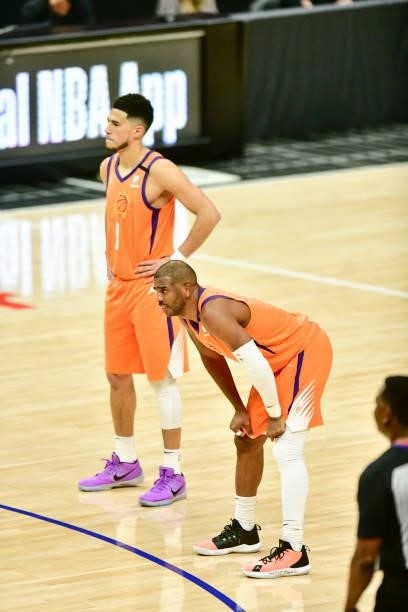 Devin Booker of the Phoenix Suns and Chris Paul of the Phoenix Suns look on during the game against the LA Clippers during Game 6 of the Western...