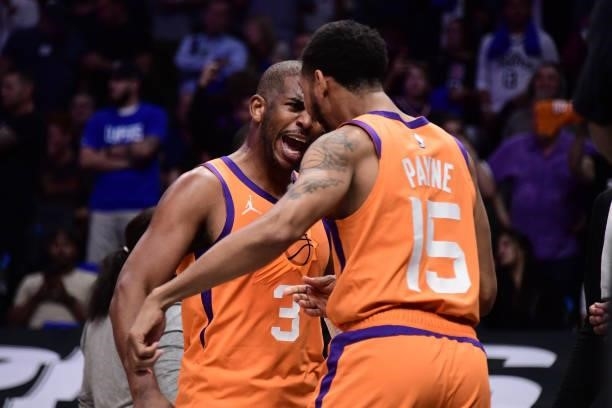 Chris Paul celebrates with Cameron Payne of the Phoenix Suns during Game 6 of the Western Conference Finals of the 2021 NBA Playoffs on June 30, 2021...