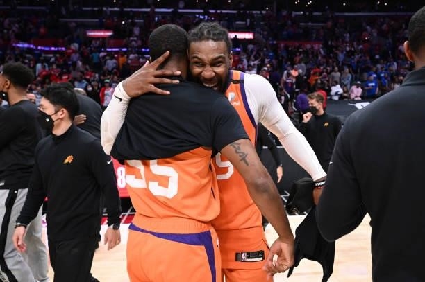 Twaun Moore hugs Jae Crowder of the Phoenix Suns after the game during Game 6 of the Western Conference Finals of the 2021 NBA Playoffs on June 30,...