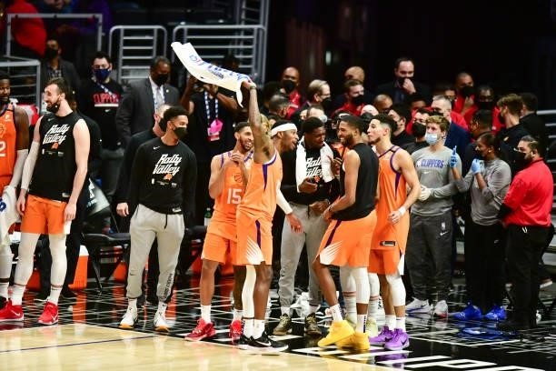 Torrey Craig of the Phoenix Suns, Langston Galloway of the Phoenix Suns and Mikal Bridges of the Phoenix Suns celebrate during the game against the...