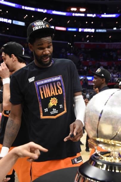Deandre Ayton of the Phoenix Suns looks at the Western Conference Finals trophy after Game 6 of the Western Conference Finals of the 2021 NBA...
