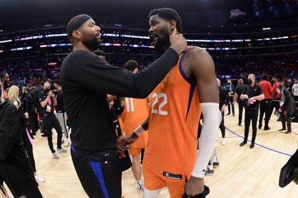 Deandre Ayton of the Phoenix Suns talks with DeMarcus Cousins of the LA Clippers after Game 6 of the Western Conference Finals of the 2021 NBA...