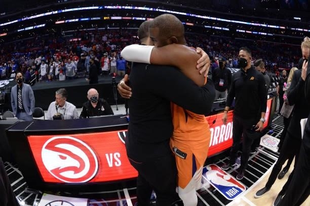 Chris Paul of the Phoenix Suns hugs Head Coach Tyronn Lue of the Los Angeles Clippers after Game 6 of the Western Conference Finals of the 2021 NBA...