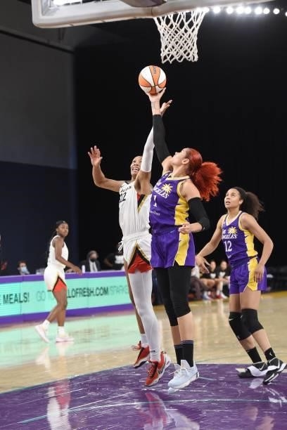 Ja Wilson of the Las Vegas Aces and Amanda Zahui B of the Los Angeles Sparks leap for the ball during the game on June 30, 2021 at the Los Angeles...