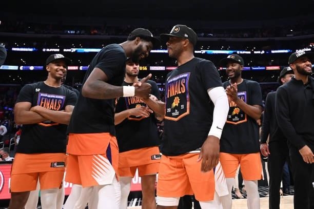 Chris Paul and Deandre Ayton of the Phoenix Suns celebrate after winning the Western Conference Finals of the 2021 NBA Playoffs on June 30, 2021 at...