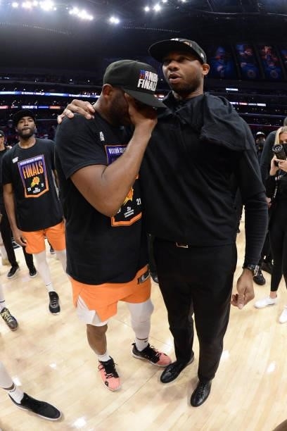 Chris Paul of the Phoenix Suns hugs Assistant Coach Willie Green of the Phoenix Suns after winning the Western Conference Finals of the 2021 NBA...