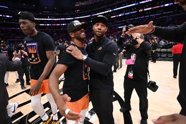 Chris Paul of the Phoenix Suns celebrates with Assistant Coach, Willie Green after winning the Western Conference Finals of the 2021 NBA Playoffs on...