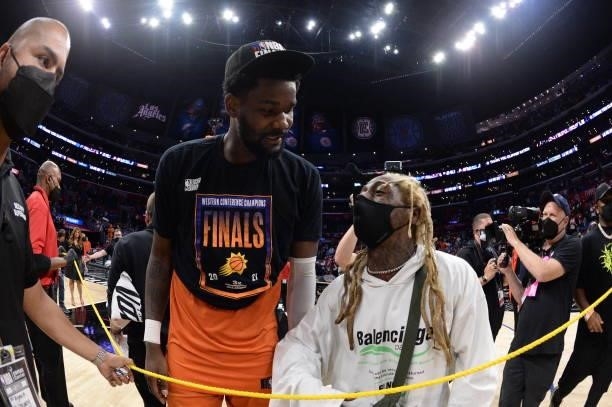 Deandre Ayton of the Phoenix Suns talks with rapper, Lil Wayne after Game 6 of the Western Conference Finals of the 2021 NBA Playoffs on June 30,...