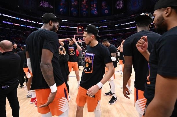 Devin Booker celebrates with Deandre Ayton of the Phoenix Suns during Game 6 of the Western Conference Finals of the 2021 NBA Playoffs on June 30,...
