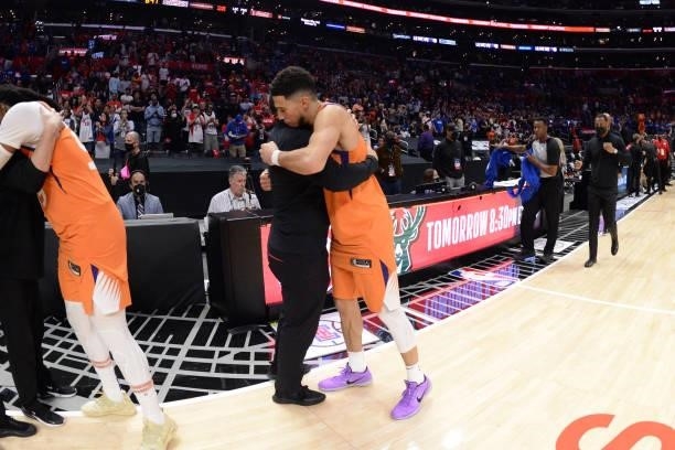 Devin Booker of the Phoenix Suns hugs Head Coach Tyronn Lue of the Los Angeles Clippers after Game 6 of the Western Conference Finals of the 2021 NBA...