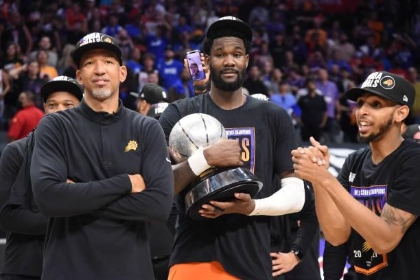 Deandre Ayton of the Phoenix Suns holds the Western Conference Finals trophy after winning Game 6 of the Western Conference Finals of the 2021 NBA...