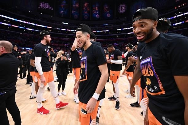 Devin Booker and Mikal Bridges of the Phoenix Suns celebrate during Game 6 of the Western Conference Finals of the 2021 NBA Playoffs on June 30, 2021...