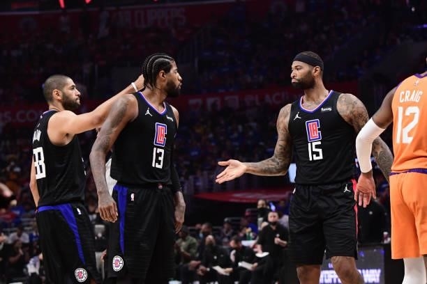 DeMarcus Cousins hi-fives Paul George of the LA Clippers during Game 6 of the Western Conference Finals of the 2021 NBA Playoffs on June 30, 2021 at...