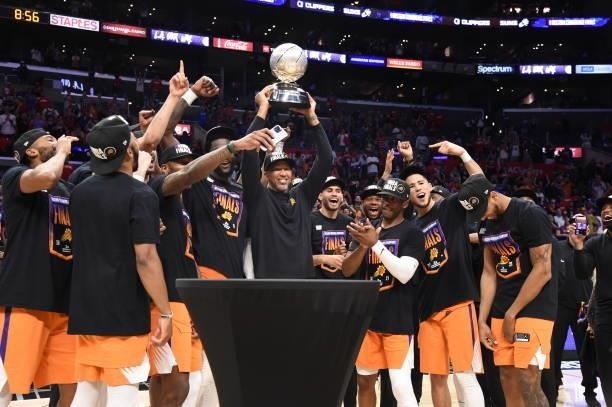 Head Coach Monty Williams of the Phoenix Suns holds up the Western Conference Finals trophy after Game 6 of the Western Conference Finals of the 2021...