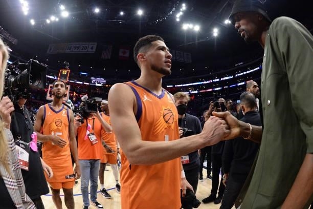 Devin Booker of the Phoenix Suns high fives Serge Ibaka of the LA Clippers after Game 6 of the Western Conference Finals of the 2021 NBA Playoffs on...
