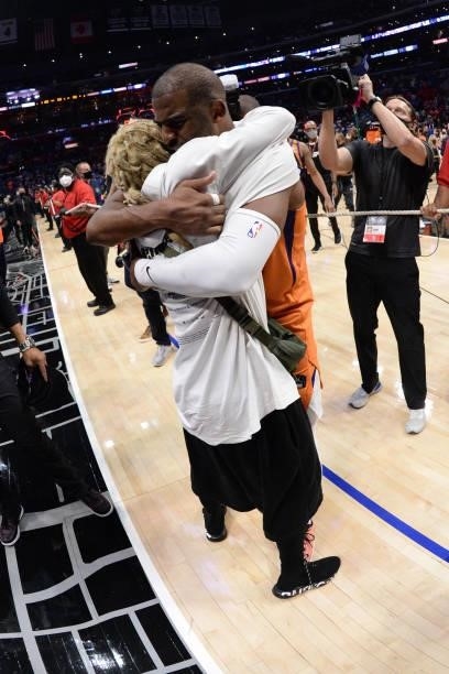 Chris Paul of the Phoenix Suns hugs rapper, Lil Wayne after Game 6 of the Western Conference Finals of the 2021 NBA Playoffs on June 30, 2021 at...