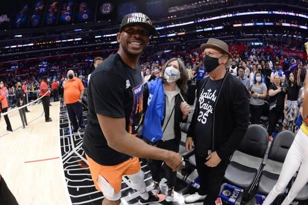 Chris Paul of the Phoenix Suns hugs actor, Billy Crystal after Game 6 of the Western Conference Finals of the 2021 NBA Playoffs on June 30, 2021 at...