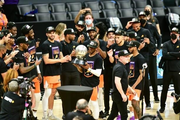 Chris Paul of the Phoenix Suns holds the Western Conference Finals Trophy after the game against the LA Clippers during Game 6 of the Western...