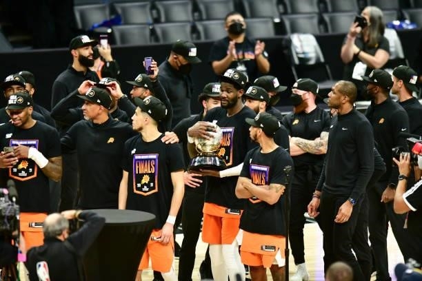 Deandre Ayton of the Phoenix Suns holds the Western Conference Finals Trophy after the game against the LA Clippers during Game 6 of the Western...