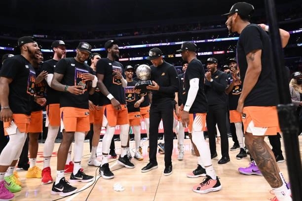Head Coach Monty Williams of the Phoenix Suns holds the Western Conference Finals trophy after Game 6 of the Western Conference Finals of the 2021...