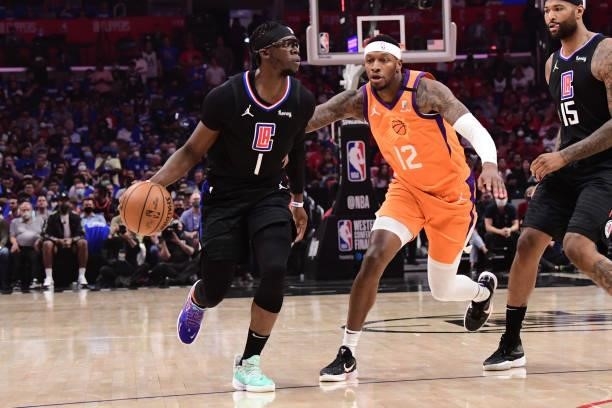 Torrey Craig of the Phoenix Suns plays defense on Reggie Jackson of the LA Clippers during Game 6 of the Western Conference Finals of the 2021 NBA...