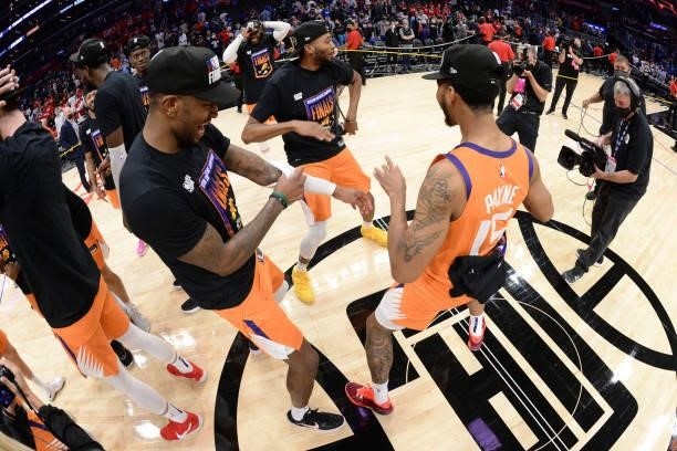 Mikal Bridges of the Phoenix Suns, Cameron Payne of the Phoenix Suns and Torrey Craig of the Phoenix Suns celebrate winning the Western Conference...