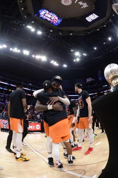 Deandre Ayton of the Phoenix Suns hugs Chris Paul of the Phoenix Suns after winning the Western Conference Finals of the 2021 NBA Playoffs on June...