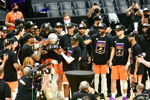 Chris Paul of the Phoenix Suns holds the Western Conference Finals Trophy after the game against the LA Clippers during Game 6 of the Western...