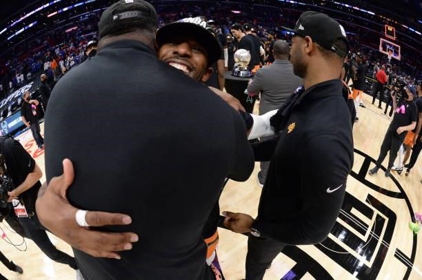 Chris Paul of the Phoenix Suns hugs Assistant Coaches, Mark Bryant and Willie Green of the Phoenix Suns after Game 6 of the Western Conference Finals...