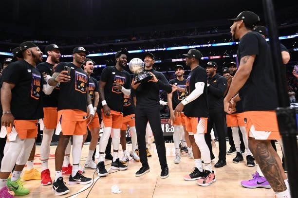 Head Coach Monty Williams of the Phoenix Suns holds the Western Conference Finals trophy after Game 6 of the Western Conference Finals of the 2021...