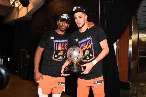 Chris Paul and Devin Booker of the Phoenix Suns celebrate after winning the Western Conference Finals of the 2021 NBA Playoffs on June 30, 2021 at...
