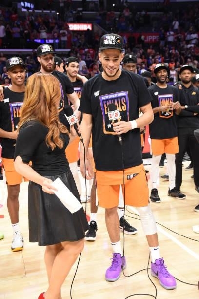 Devin Booker of the Phoenix Suns interviews with ESPN sideline reporter, Rachel Nichols after winning the Western Conference Finals of the 2021 NBA...