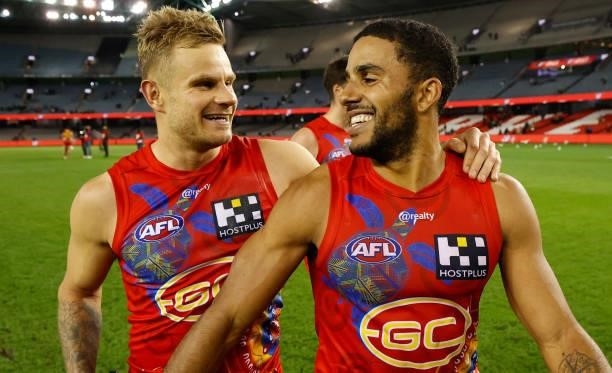 Brandon Ellis and Touk Miller of the Suns celebrate during the 2021 AFL Round 16 match between the Gold Coast Suns and the Richmond Tigers at Marvel...