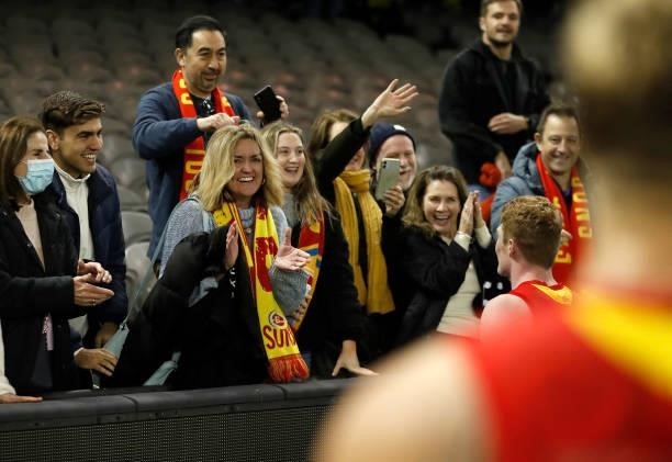 Suns fans celebrate during the 2021 AFL Round 16 match between the Gold Coast Suns and the Richmond Tigers at Marvel Stadium on July 01, 2021 in...