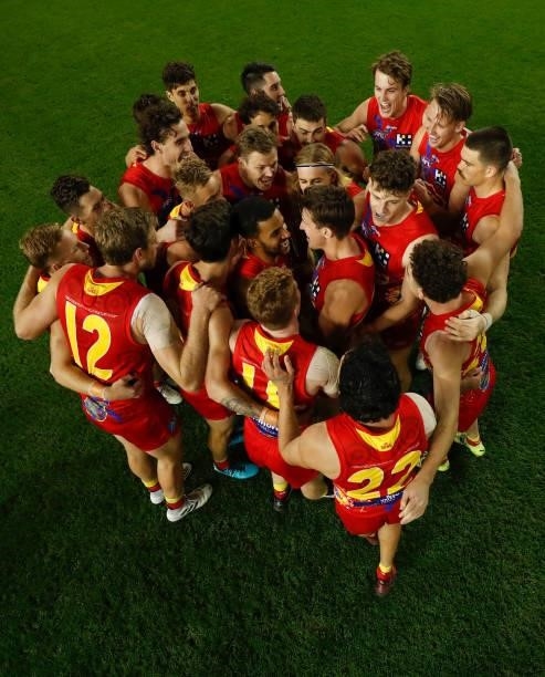 The Suns huddle during the 2021 AFL Round 16 match between the Gold Coast Suns and the Richmond Tigers at Marvel Stadium on July 01, 2021 in...