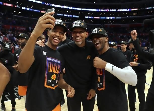 Ty-Shon Alexander, Head Coach, Monty Williams and Chris Paul of the Phoenix Suns pose for a photo after winning the Western Conference Finals of the...