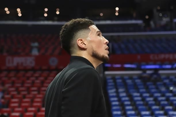 Devin Booker of the Phoenix Suns looks on before the game against the LA Clippers during Game 6 of the Western Conference Finals of the 2021 NBA...
