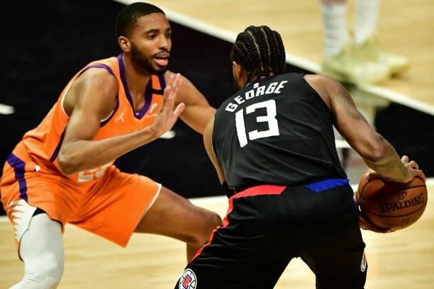 Mikal Bridges of the Phoenix Suns plays defense on Paul George of the LA Clippers during Game 6 of the Western Conference Finals of the 2021 NBA...