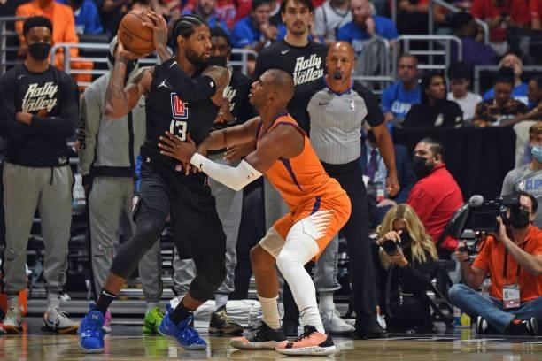 Chris Paul of the Phoenix Suns plays defense on Paul George of the LA Clippers during Game 6 of the Western Conference Finals of the 2021 NBA...