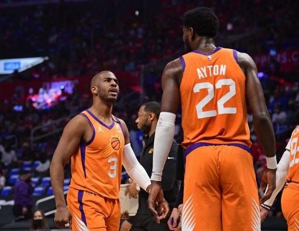 Chris Paul talks with Deandre Ayton of the Phoenix Suns during Game 6 of the Western Conference Finals of the 2021 NBA Playoffs on June 30, 2021 at...